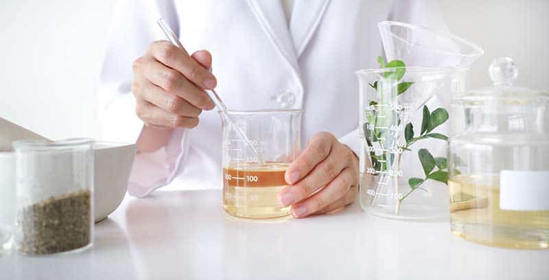 Rod stirring beaker in laboratory